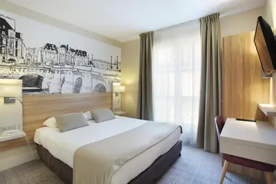 Un ou plusieurs lits dans un hébergement de l'établissement Hotel Lautrec Opera