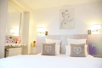 Un ou plusieurs lits dans un hébergement de l'établissement Hôtel Malar