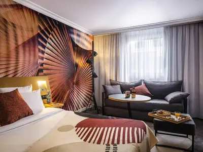 Un ou plusieurs lits dans un hébergement de l'établissement Novotel Paris Vaugirard Montparnasse