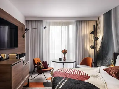 Un ou plusieurs lits dans un hébergement de l'établissement Novotel Paris Vaugirard Montparnasse