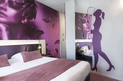 Un ou plusieurs lits dans un hébergement de l'établissement Le Bon Hôtel