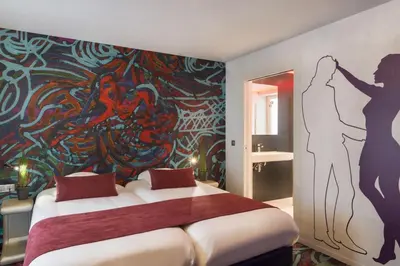 Un ou plusieurs lits dans un hébergement de l'établissement Le Bon Hôtel