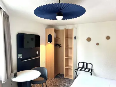 Un ou plusieurs lits dans un hébergement de l'établissement ibis Paris Brancion Parc des Expositions 15ème