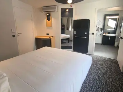Un ou plusieurs lits dans un hébergement de l'établissement ibis Paris Brancion Parc des Expositions 15ème
