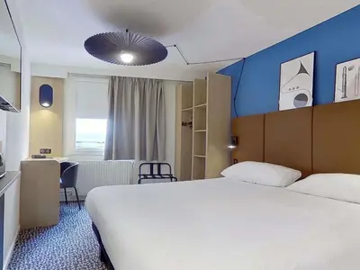Un ou plusieurs lits dans un hébergement de l'établissement ibis Paris Brancion Parc des Expositions 15ème