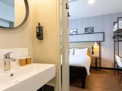 Un ou plusieurs lits dans un hébergement de l'établissement ibis Paris Boulogne Billancourt