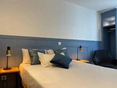 Un ou plusieurs lits dans un hébergement de l'établissement Hotel Little Regina