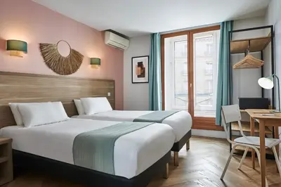 Un ou plusieurs lits dans un hébergement de l'établissement Hôtel Kabanel by Happyculture