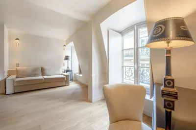 Un ou plusieurs lits dans un hébergement de l'établissement Hotel Résidence Des Arts - Saint-Germain