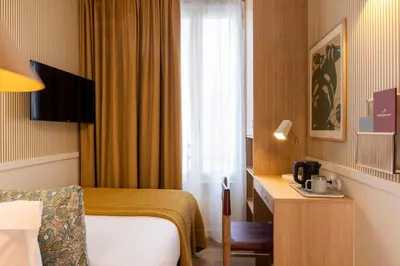 Télévision ou salle de divertissement dans l'établissement Le Petit Oberkampf Hotel & Spa