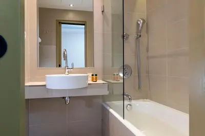 Salle de bains dans l'établissement Hôtel De La Paix
