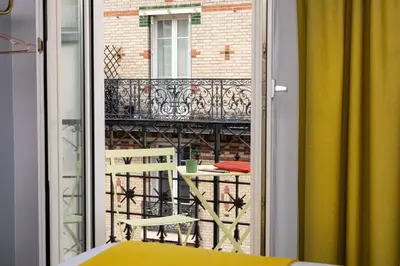 Balcon ou terrasse dans l'établissement Hôtel De La Paix