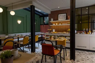 Restaurant ou autre lieu de restauration dans l'établissement Hôtel De La Paix