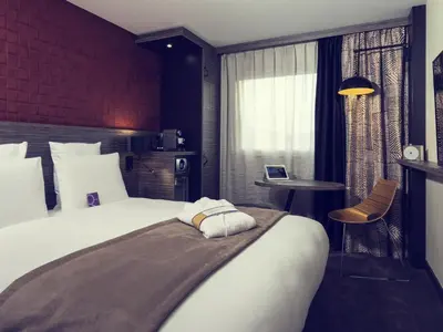 Un ou plusieurs lits dans un hébergement de l'établissement Mercure Paris Porte de Pantin