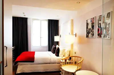 Un ou plusieurs lits dans un hébergement de l'établissement Hotel Le Placide Saint-Germain Des Prés