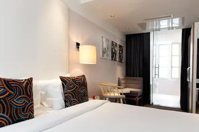 Un ou plusieurs lits dans un hébergement de l'établissement Hotel Le Placide Saint-Germain Des Prés