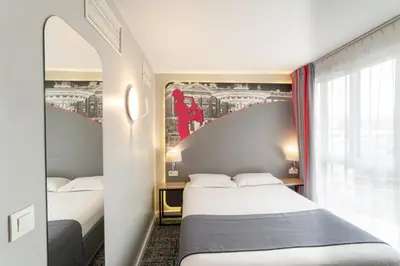 Un ou plusieurs lits dans un hébergement de l'établissement Hotel Inn Design Paris Place d'italie