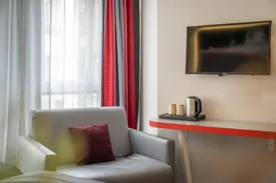 Télévision ou salle de divertissement dans l'établissement Hotel Inn Design Paris Place d'italie