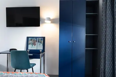 Télévision ou salle de divertissement dans l'établissement Palym