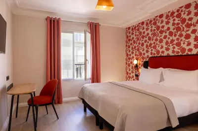 Un ou plusieurs lits dans un hébergement de l'établissement Hotel le 46
