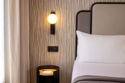 Un ou plusieurs lits dans un hébergement de l'établissement Hotel le 46