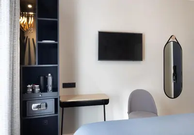 Télévision ou salle de divertissement dans l'établissement Hotel le 46