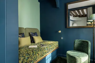 Un ou plusieurs lits dans un hébergement de l'établissement Hotel L de Lutece - Notre-Dame