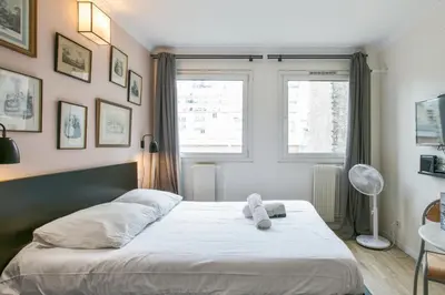 Un ou plusieurs lits dans un hébergement de l'établissement Cozy studio 10 min from Eiffel Tower Invalides Beaugrenelle