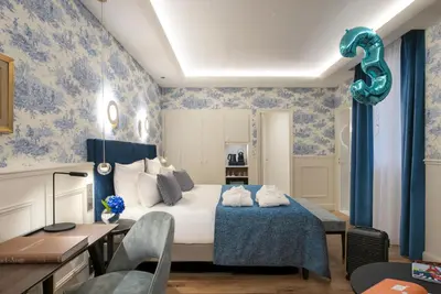 Un ou plusieurs lits dans un hébergement de l'établissement Hotel Cambon