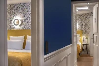 Un ou plusieurs lits dans un hébergement de l'établissement Hotel Cambon