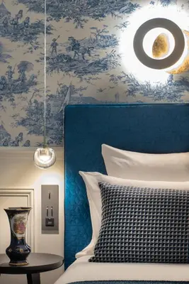 Un ou plusieurs lits dans un hébergement de l'établissement Hotel Cambon