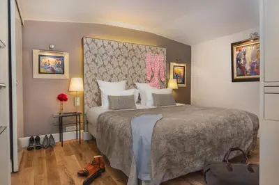 Un ou plusieurs lits dans un hébergement de l'établissement Hotel Cambon