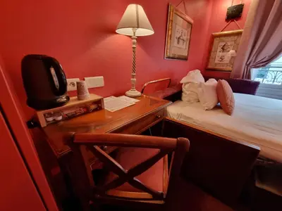 Un ou plusieurs lits dans un hébergement de l'établissement Hôtel France Eiffel