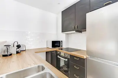 Cuisine ou kitchenette dans l'établissement Pick A Flat's Apartment in Le Marais - Rue Saint Apoline