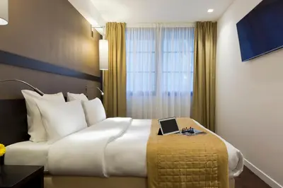 Un ou plusieurs lits dans un hébergement de l'établissement Simon's Boutique Hôtel