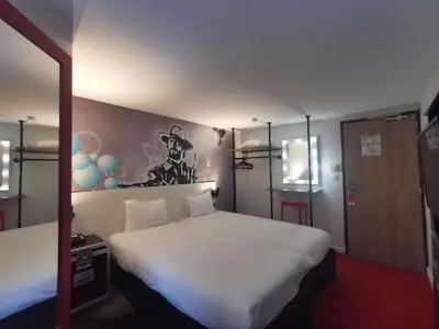 Un ou plusieurs lits dans un hébergement de l'établissement Ibis Styles Paris Saint Denis La Plaine