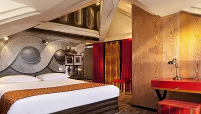 Un ou plusieurs lits dans un hébergement de l'établissement Hotel Le Notre Dame Saint Michel