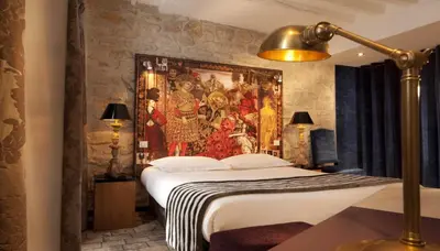 Un ou plusieurs lits dans un hébergement de l'établissement Hotel Le Notre Dame Saint Michel