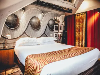 Un ou plusieurs lits dans un hébergement de l'établissement Hotel Le Notre Dame Saint Michel
