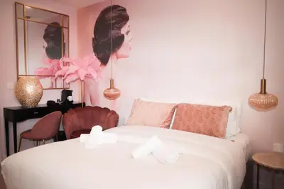 Un ou plusieurs lits dans un hébergement de l'établissement Le Glam's Hotel