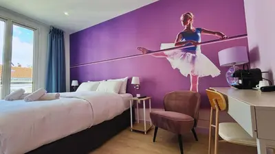 Un ou plusieurs lits dans un hébergement de l'établissement Le Glam's Hotel