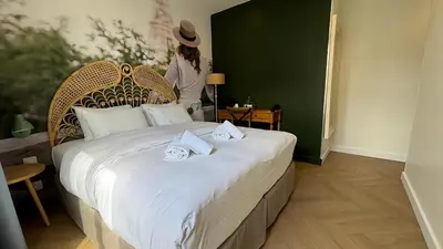 Un ou plusieurs lits dans un hébergement de l'établissement Le Glam's Hotel