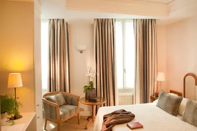 Un ou plusieurs lits dans un hébergement de l'établissement Hôtel De l'Arcade