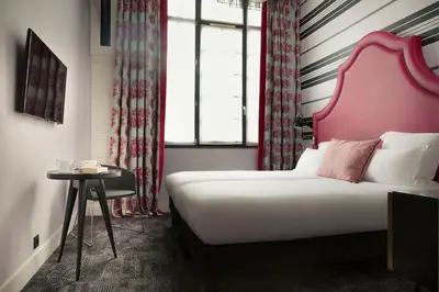 Un ou plusieurs lits dans un hébergement de l'établissement Hôtel Fabric