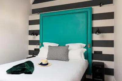 Un ou plusieurs lits dans un hébergement de l'établissement Hôtel Fabric