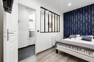 Un ou plusieurs lits dans un hébergement de l'établissement GuestReady - Nice apartment for 6 in Paris