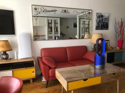 Coin salon dans l'établissement Beau studio Bastille
