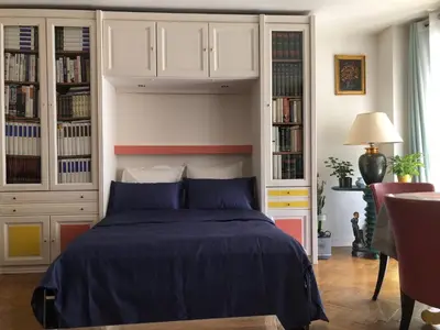 Un ou plusieurs lits dans un hébergement de l'établissement Beau studio Bastille