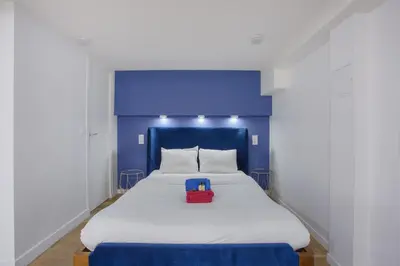 Un ou plusieurs lits dans un hébergement de l'établissement Rent a Room - 2P Passage du Caire