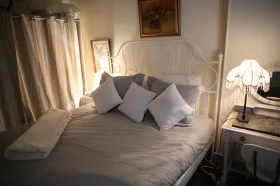 Un ou plusieurs lits dans un hébergement de l'établissement Montmartre's appartement